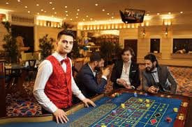 Dream Gaming live casino dealer table with multiple camera angles and football match feed